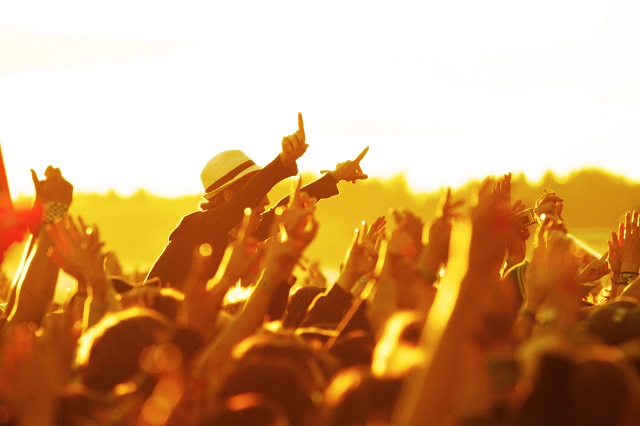 cheering open-air crowd cheering sunset